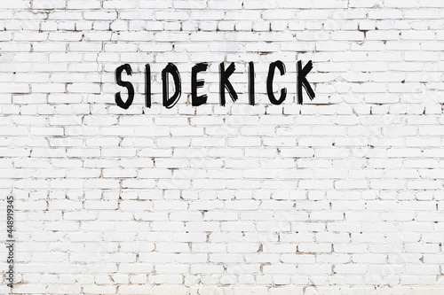 Photos Inscription sidekick painted on white brick wall