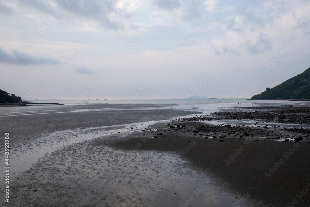 Mud beach at low tide at sunset 