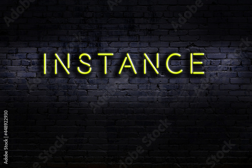 Canvas-taulu Night view of neon sign on brick wall with inscription instance
