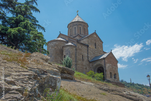 Georgia. Ananuri fortress. Stone walls. Clay tile. Mountain Lake.