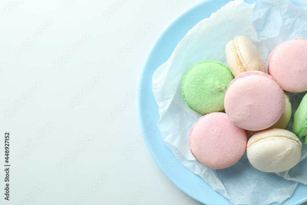 Concept of tasty dessert with macaroons on white background Concept of tasty dessert with macaroons on white background
