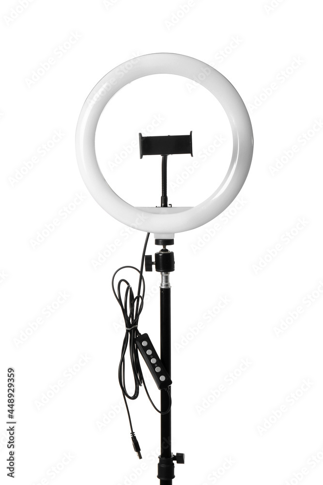 Modern ring light on stand against white background Modern ring light on stand against white background