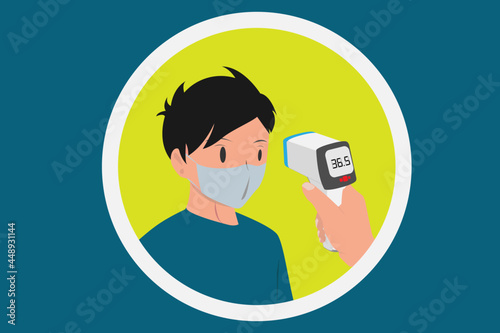 Covid-19 or coronavirus body temperature check is required. Using infrared temperature thermometer on the forehead