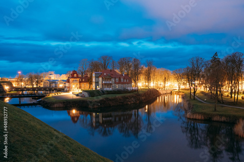 Kuressaare, Estonia. Old Wooden Mansion Ekesparre Boutique Hotel In Wooden Art Nouveau In Evening Blue Hour Night