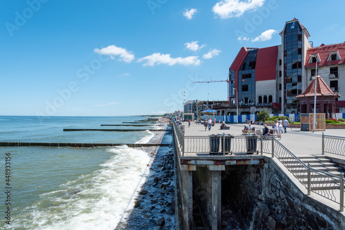 The coast of the city of Zelenogradsk with a view of the embankment, houses and pier, top view. photo