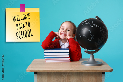 Cute little schoolgirl with...