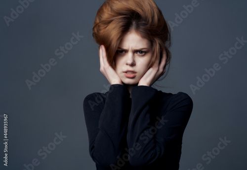 woman in black dress hairstyle fashion modern style dark background