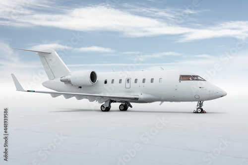 Modern white corporate business jet isolated on light background with sky