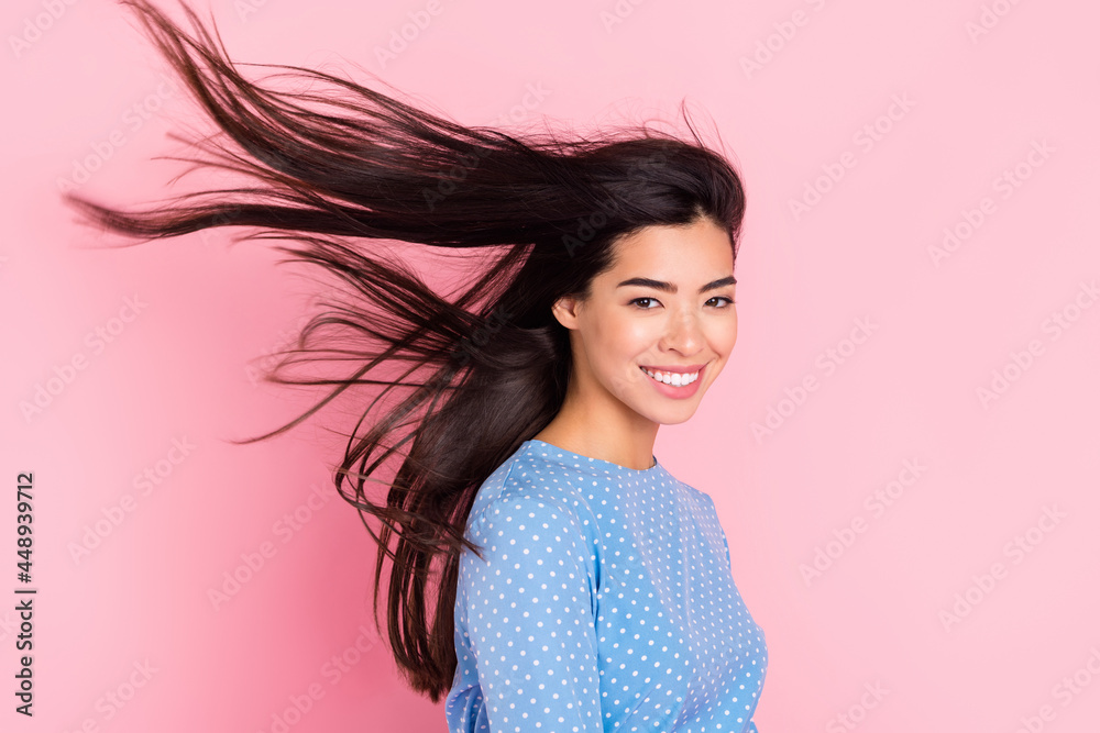 Profile side photo of young attractive girl happy positive smile wind hair new conditioner isolated over pastel color background Profile side photo of young attractive girl happy positive smile wind hair new conditioner isolated over pastel color background