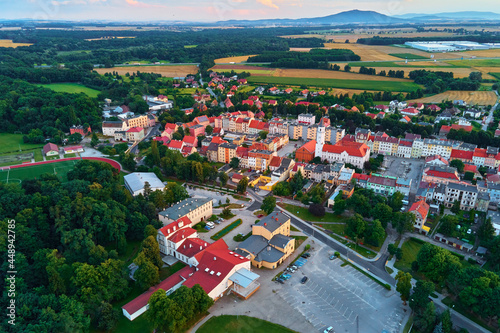 Fototapeta Naklejka Na Ścianę i Meble -  Small town in Europe, aerial view. Residential buildings and streets in small city
