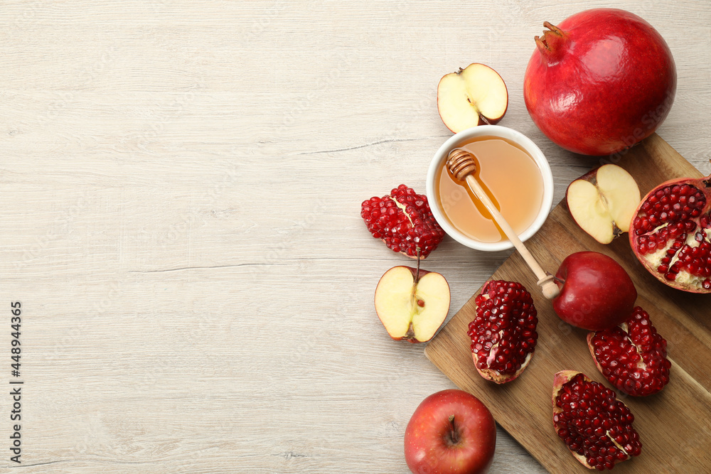 Flat lay composition with Rosh Hashanah holiday attributes on white wooden table. Space for text Flat lay composition with Rosh Hashanah holiday attributes on white wooden table. Space for text