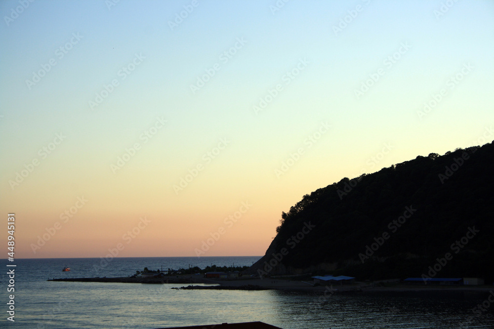 The Black Sea. Beautiful sea horizon and blue water. Evening sea. Mountain. Natural photophone.