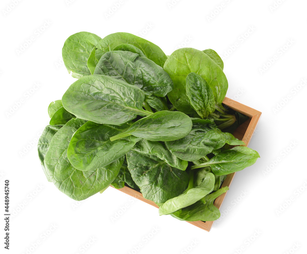 Wooden box with fresh spinach leaves on white background Wooden box with fresh spinach leaves on white background