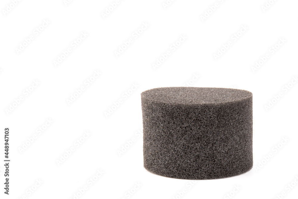 piece of foam rubber on white background. Black sponge piece of foam rubber on white background. Black sponge
