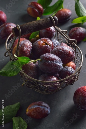 Basket with plums 