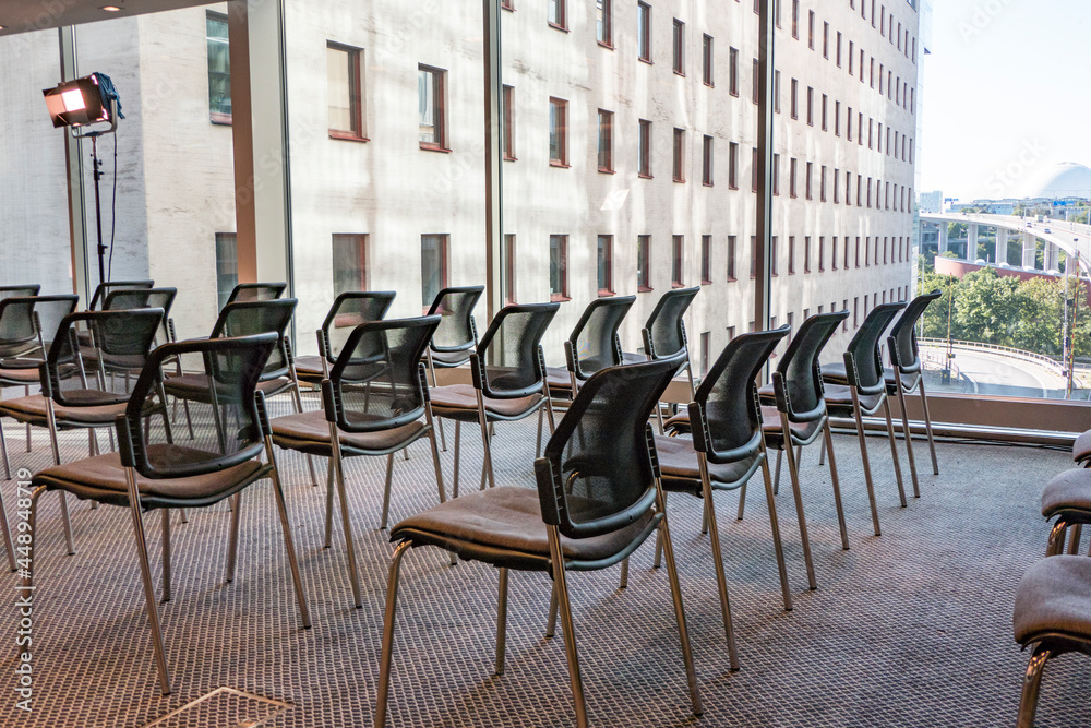 Naklejka premium Stockholm, Sweden Empty chairs in a conference room and windows.