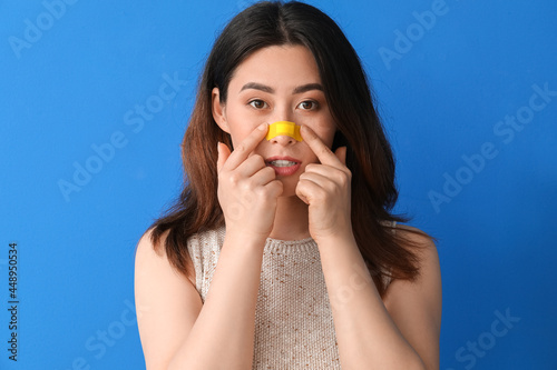 Young Asian woman with appl...