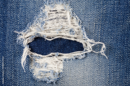 Jeans torn denim texture.