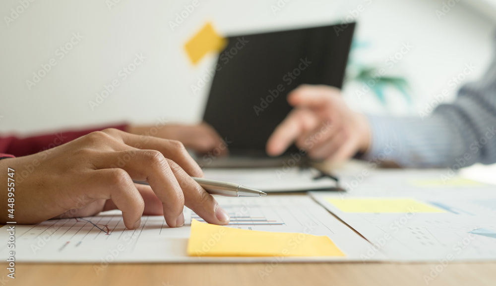 Two business leaders talk about charts, financial graphs showing results are analyzing and calculating planning strategies, business success building processes Two business leaders talk about charts, financial graphs showing results are analyzing and calculating planning strategies, business success building processes