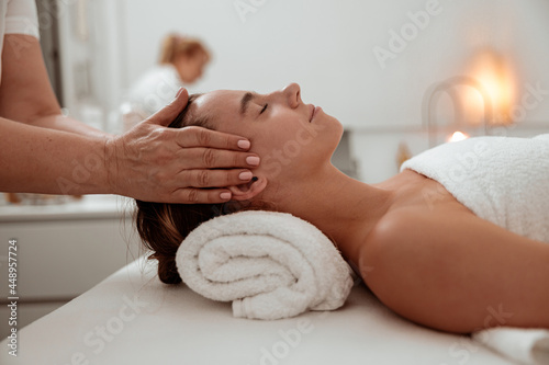 Nice woman receiving professional massage in spa salon