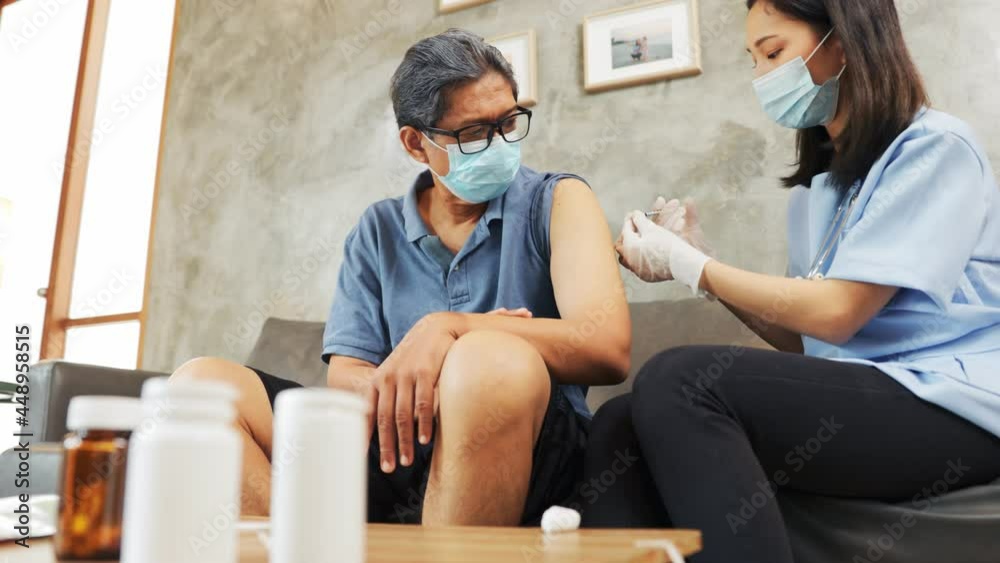 Health visitor and a senior woman during home visit.Worried senior man talking to her general practitioner visiting her at home during virus epidemic. Health visitor and a senior woman during home visit.Worried senior man talking to her general practitioner visiting her at home during virus epidemic.