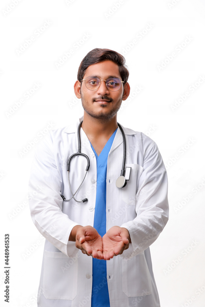 Handsome male doctor standing on white background. Handsome male doctor standing on white background.