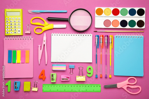 School supplies on pink background. Back to school concept.