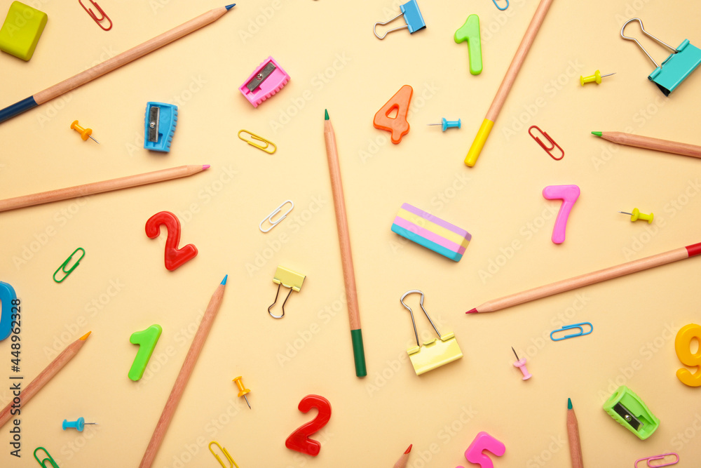 School supplies on beige background. Back to school concept. School supplies on beige background. Back to school concept.