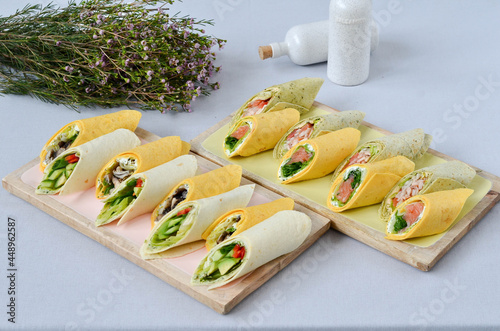 A set of beautiful canapes on a table with a gray tablecloth. Buffet table. Catering