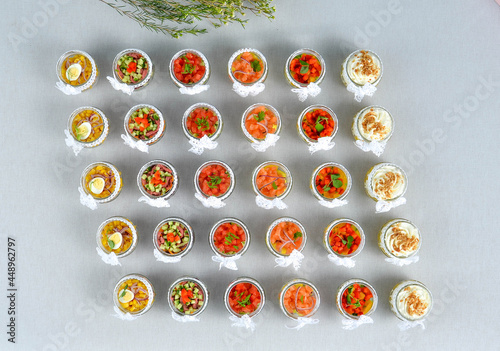 A set of beautiful canapes on a table with a gray tablecloth. Buffet table. Catering