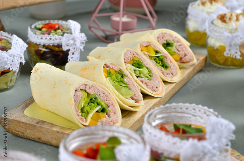 A set of beautiful canapes on a table with a gray tablecloth. Buffet table. Catering