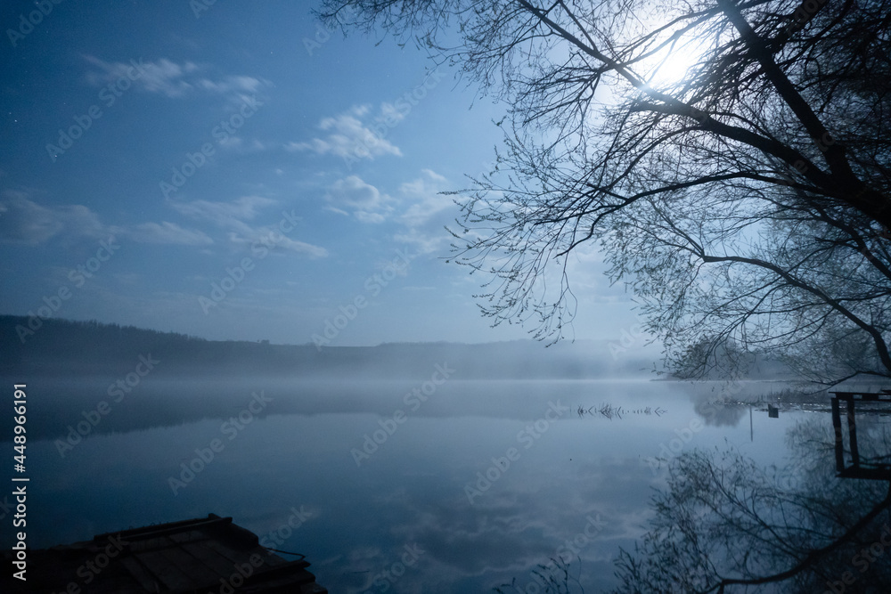 night landscape of a picturesque river with a pier. fog and full moon. night landscape of a picturesque river with a pier. fog and full moon.