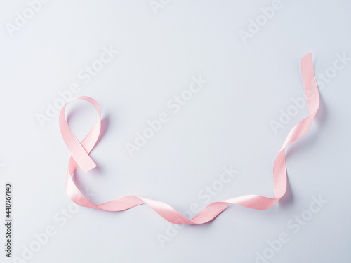 Obraz na plátně Breast cancer awareness pink ribbon symbol on gray background