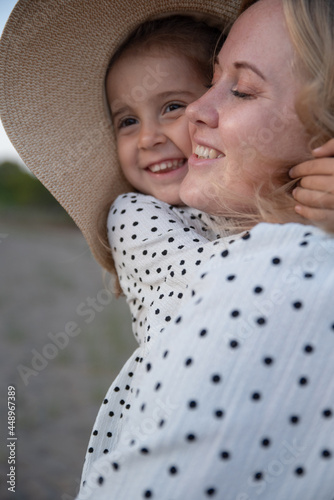 Little girl hugs mom tight