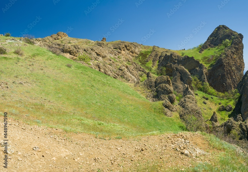 Spring panoramic landscape on Karadag volcanic mountain range located in Crimean peninsula