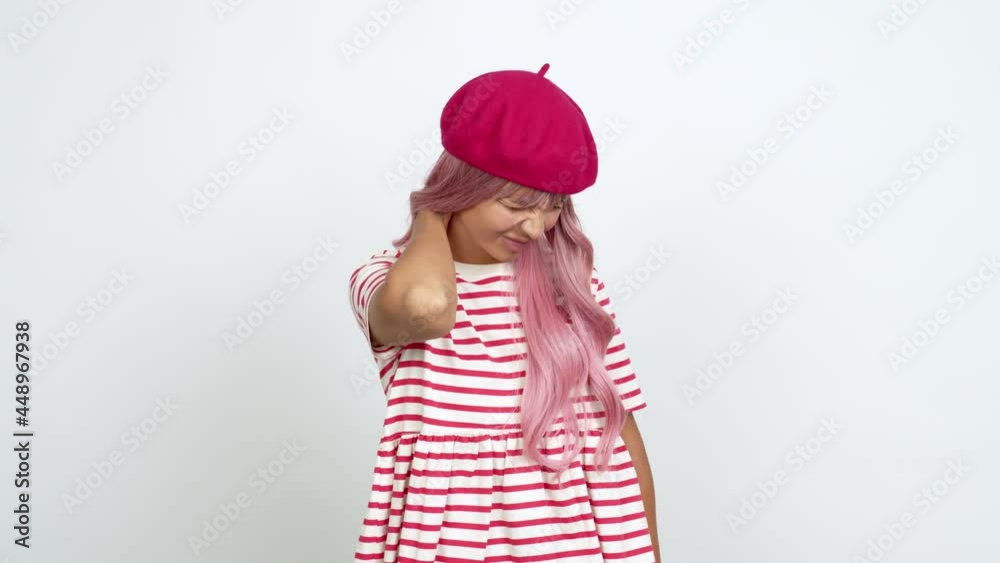 Young woman with pink hair with neck pain over isolated background Young woman with pink hair with neck pain over isolated background