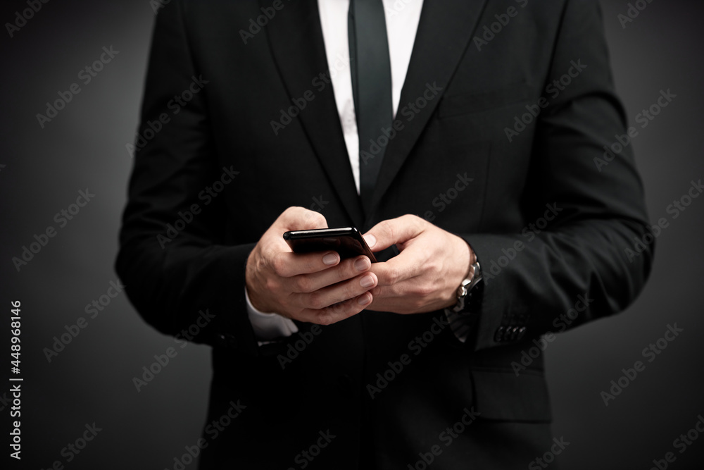 Close up of man in suit using smart phone Close up of man in suit using smart phone