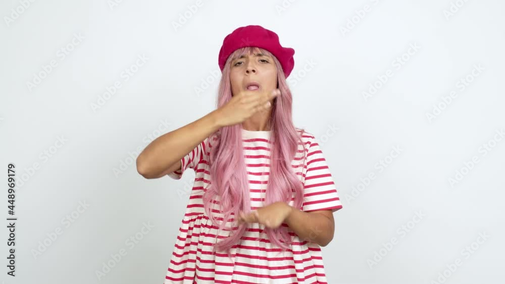 Young woman with pink hair doing time out gesture over isolated background Young woman with pink hair doing time out gesture over isolated background