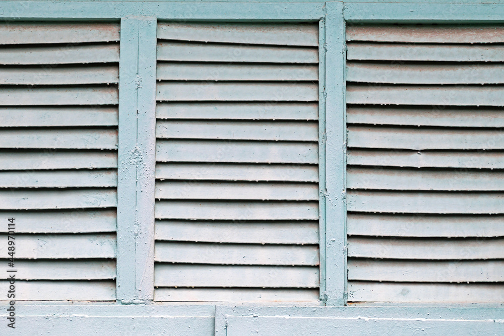 Metal window with blinds in an outbuilding Metal window with blinds in an outbuilding