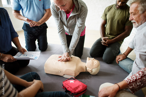 Group of diverse people in cpr training class photo