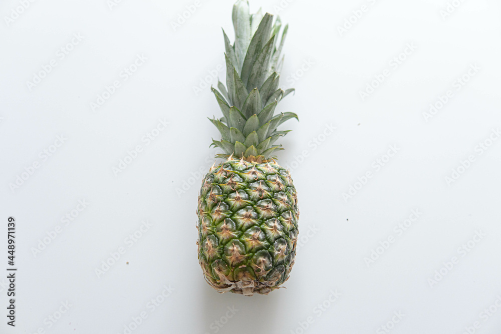 Fresh ripe pineapple fruit, pineapple fruit slices isolated. Juicy fruit design elements composition with focus stacking, white background. Tasty raw whole tropical fruit, healthy nutrition concept