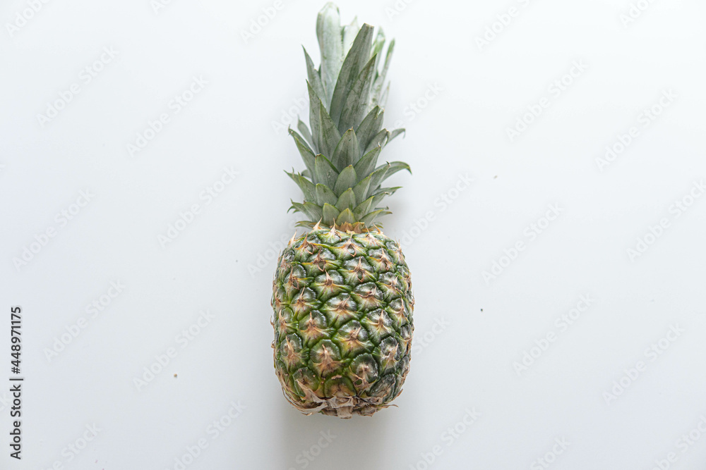 Fresh ripe pineapple fruit, pineapple fruit slices isolated. Juicy fruit design elements composition with focus stacking, white background. Tasty raw whole tropical fruit, healthy nutrition concept