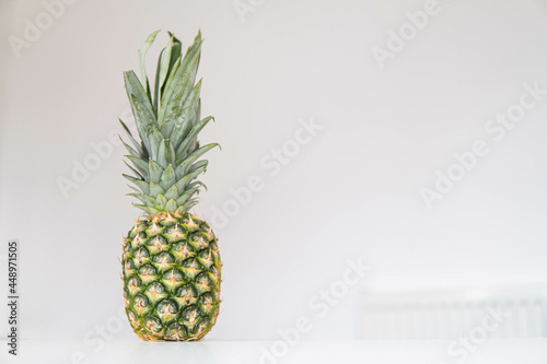 Obraz na płótnie Fresh ripe pineapple fruit, pineapple fruit slices isolated. Juicy fruit design elements composition with focus stacking, white background. Tasty raw whole tropical fruit, healthy nutrition concept
w salonie