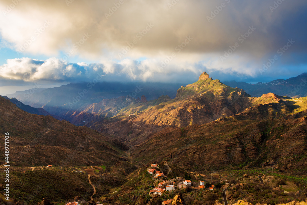 Last light of the day hits Roque Bentayga, a natural rock pinnacle on Gran Canaria, Canary Islands, Spain. The rock is located within the volcanic caldera of Tejeda, in the heart of the island.