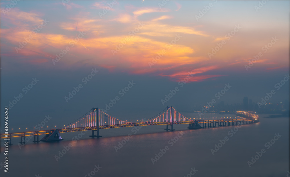 Fototapeta premium xinghai gate bridge at sunset
