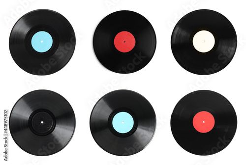 Black vintage vinyl records on white background, top view
