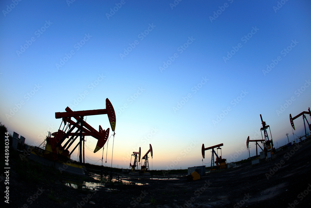 in the evening, oil pumps are running
