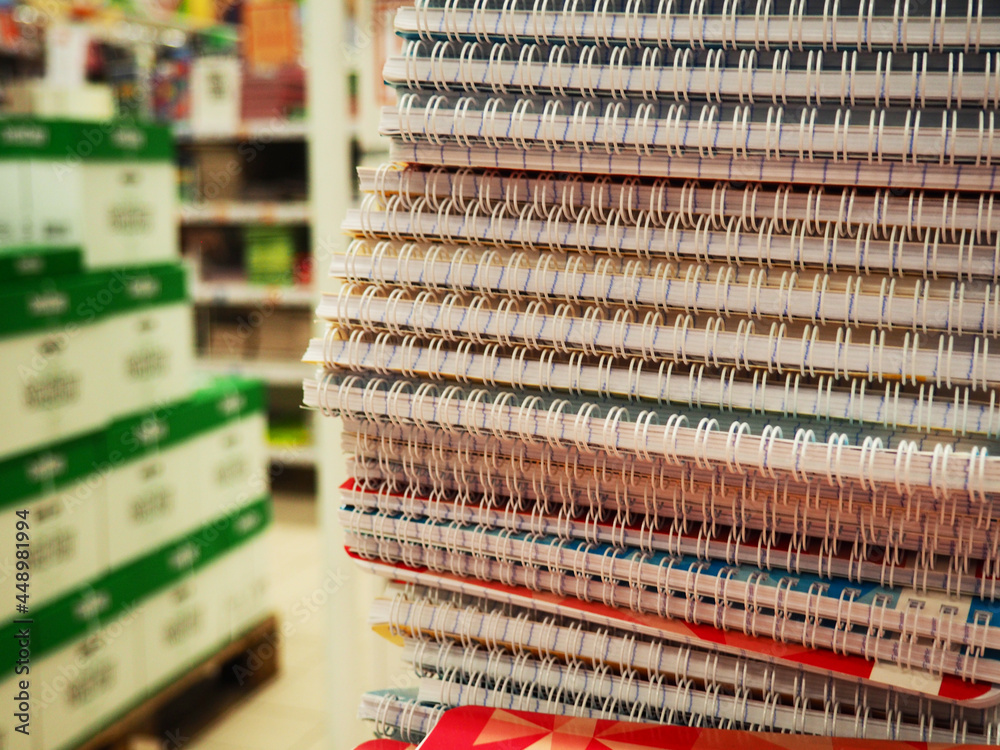 Stack notebook shop in paper art style. Many colorful notebooks on the shelves of the store. Stack of notebooks. Stack notebook shop in paper art style. Many colorful notebooks on the shelves of the store. Stack of notebooks.