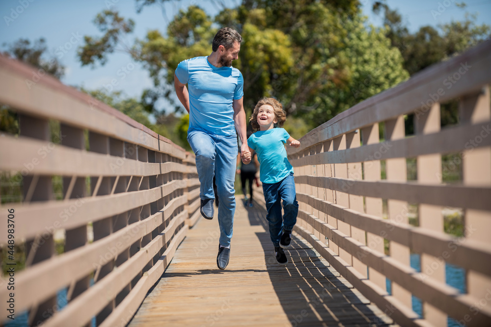 dad with kid on summer day. parenting and fatherhood. fathers day. happy father and son dad with kid on summer day. parenting and fatherhood. fathers day. happy father and son