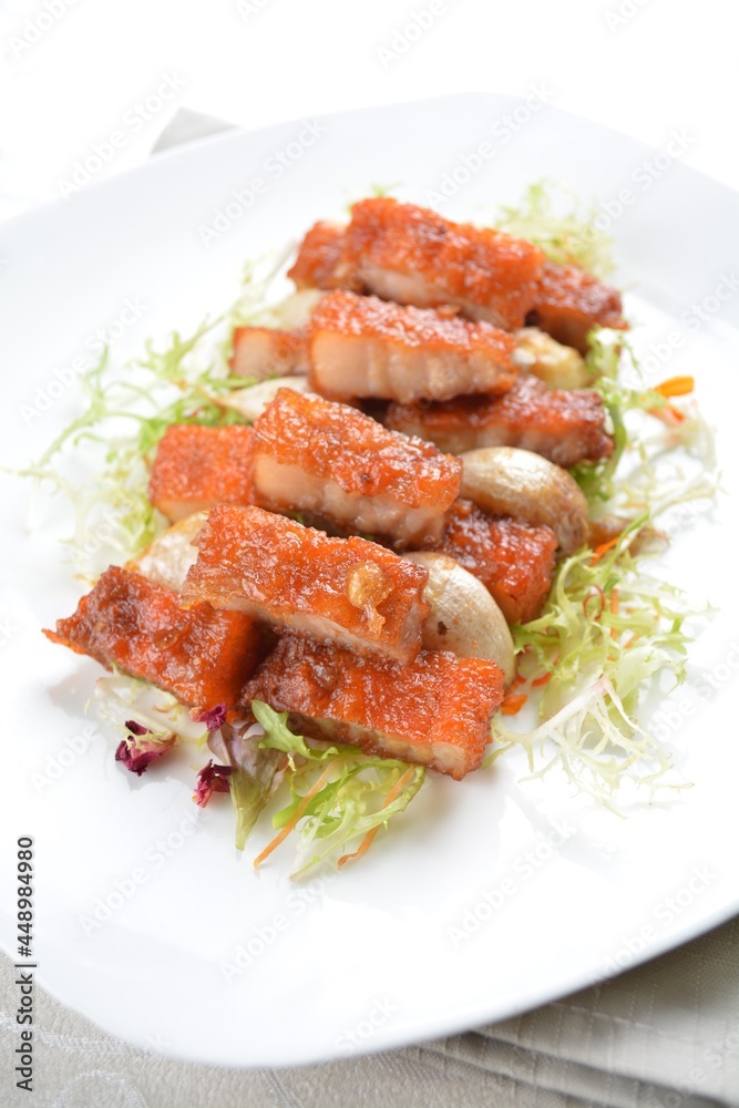 deep fried pork belly with garlic meat in white background asian halal menu deep fried pork belly with garlic meat in white background asian halal menu